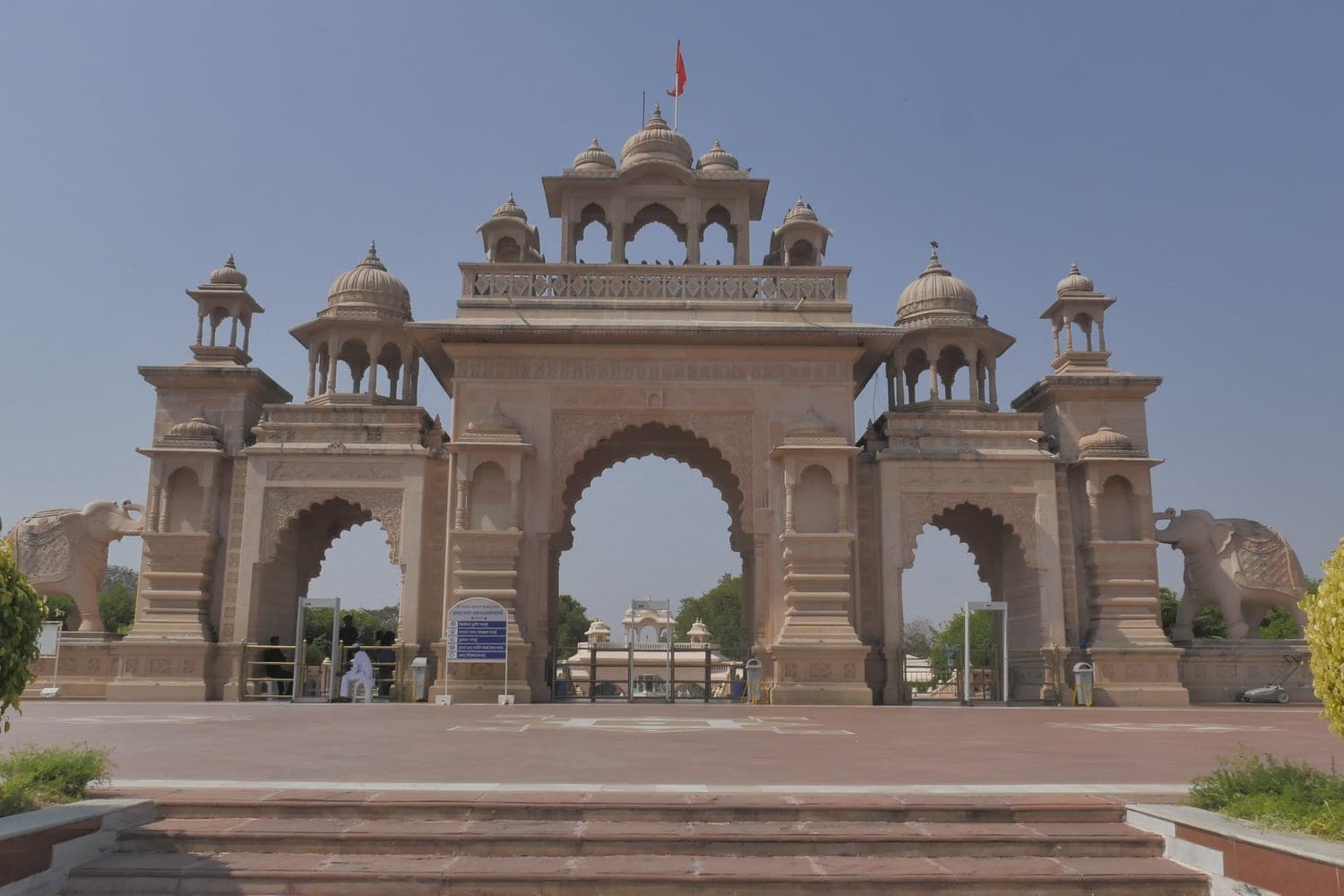The grand sandstone gateway of Anand Sagar garden and lake complex in Shegaon