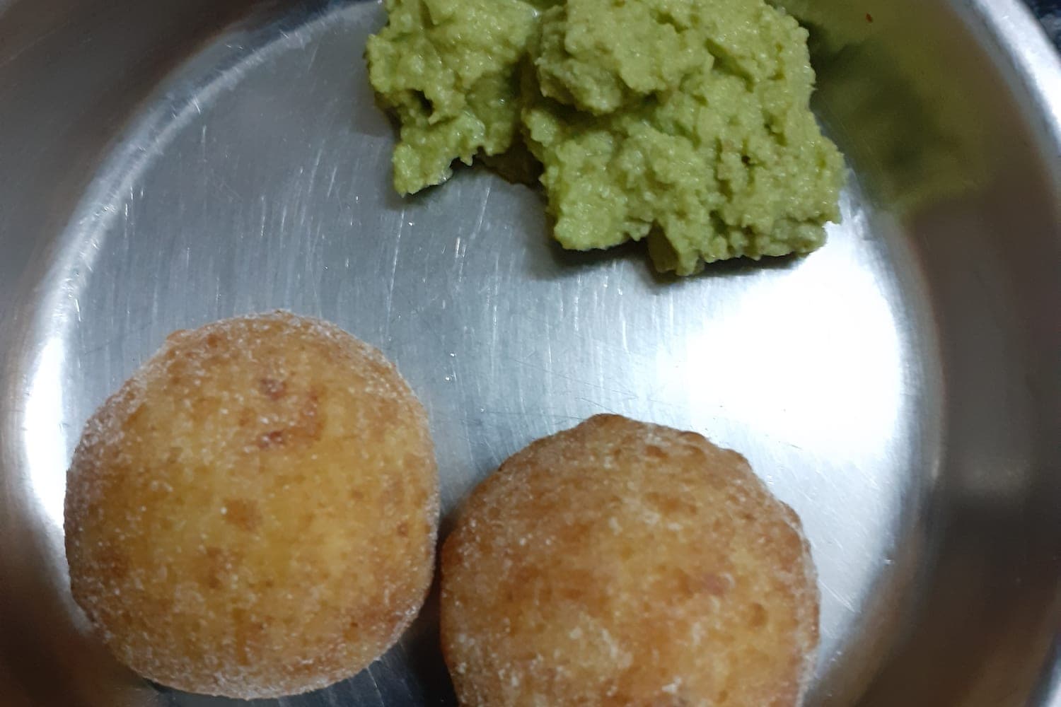 Crisp fried kachori served with green chutney, the famous Shegaon street snack
